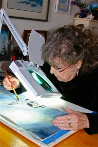 barbara painting canvas using table clamp magnifier