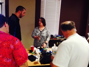 Dr. Willkomm shows her AT tools to training session attendees