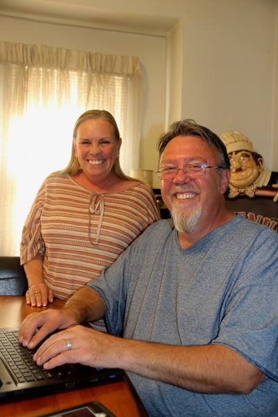 photo of kenny and belva on his computer