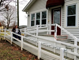 Laura Medcalf in front of her home on wheelchair ramp