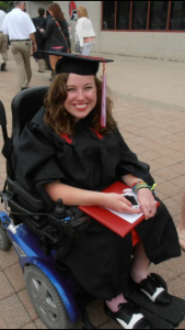 laura in cap and gown at college graduation