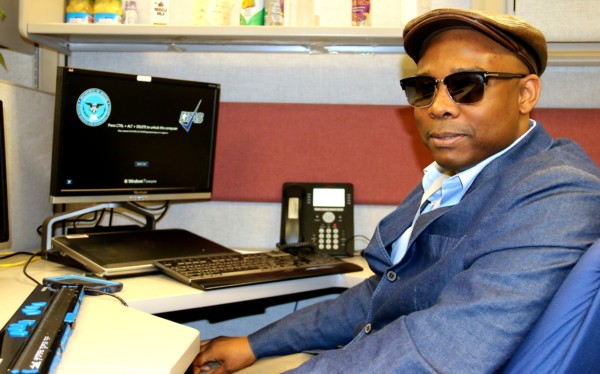 Jwyanza Maye sitting in his office space