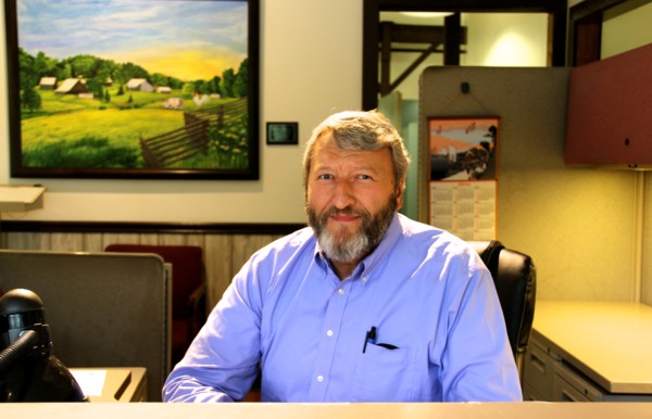 Gary Bradley at reception desk at Rose Acre Farms