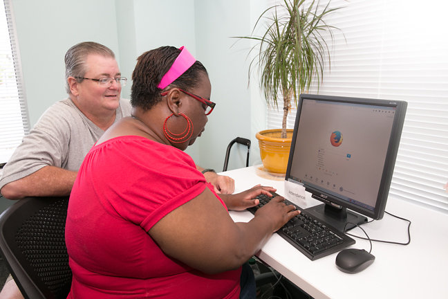 woman and man on computer