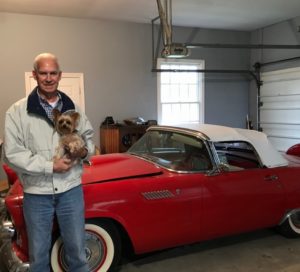 Berlon with his yorkshire terrier dog and his car