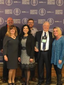 Members of advisory committee with champions of inclusion award