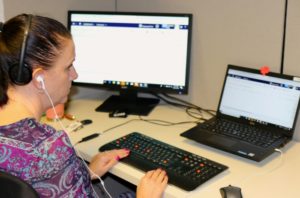 Kristy working at her desk