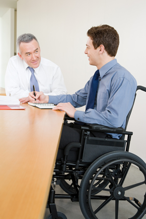 Male office worker in wheelchair