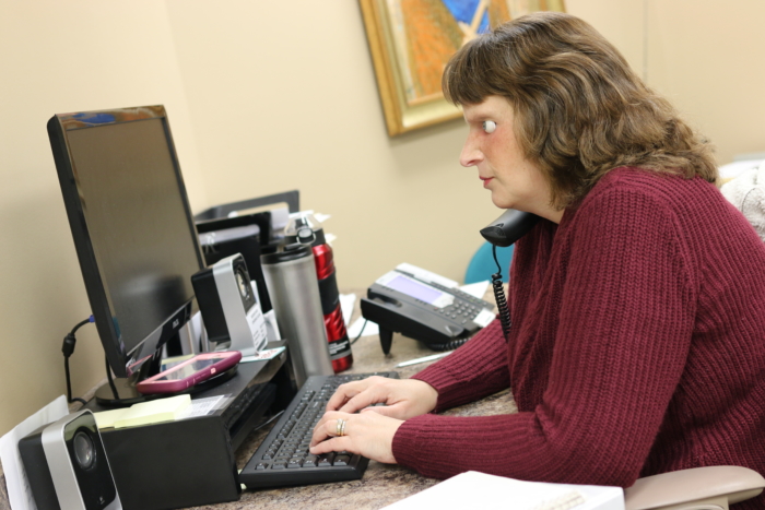 Tracy working at her desk