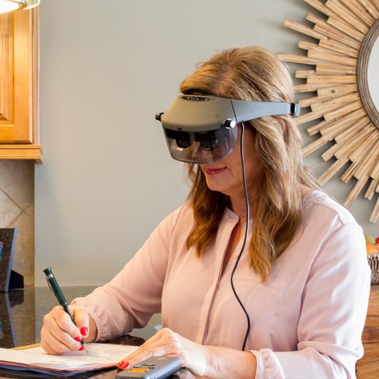 Woman using head-mounted vision device