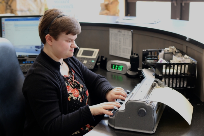 Jodi using her Braille embosser