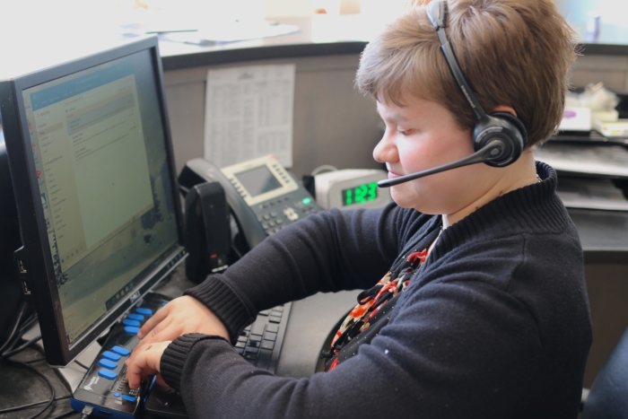 Jodi using braille notetaker