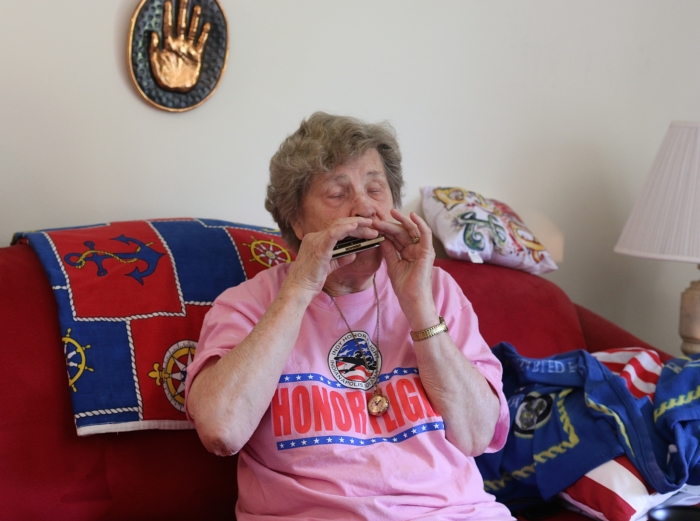 Mildred playing the harmonica