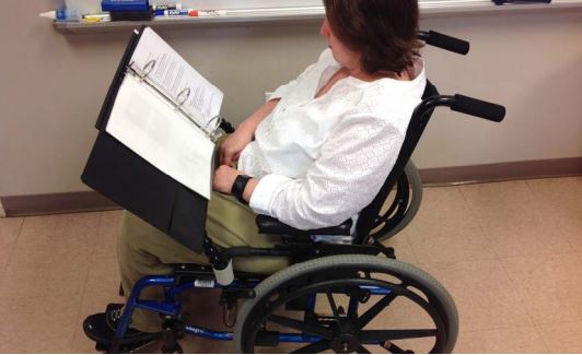 Book holder for wheelchair