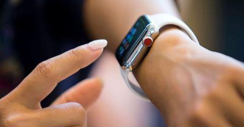 Woman using Apple Watch