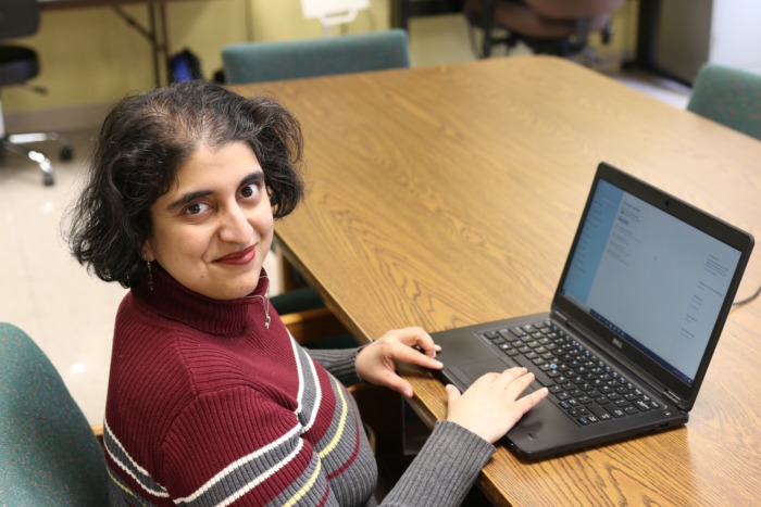 Radha working on laptop