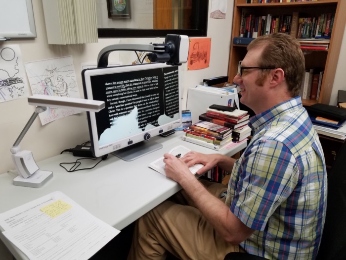 Mike DiSanto using desktop magnifier