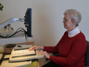 Candy Sherd using desktop magnifier