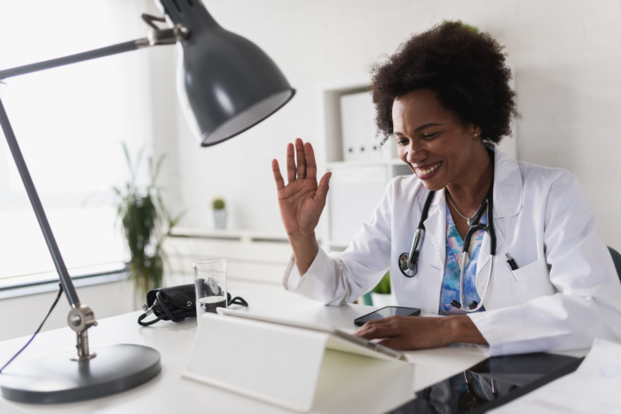 A doctor conducting a telehealth session