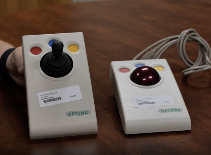 a photo of optima joystick and optima trackball