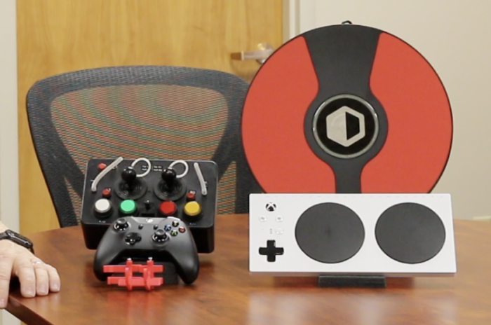 a few accessible gaming controllers on a table
