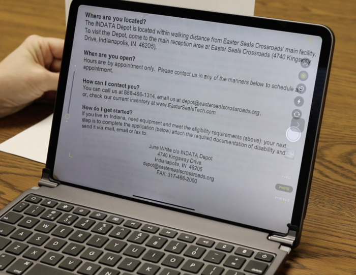 Screenshot of iPad with document behind it using the OCR Live Text speech feature