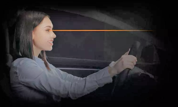 Woman with Eyeware driving car