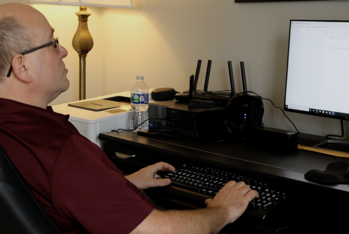 screenshot of Dave Brodzinski at his desk using JAWS computer software