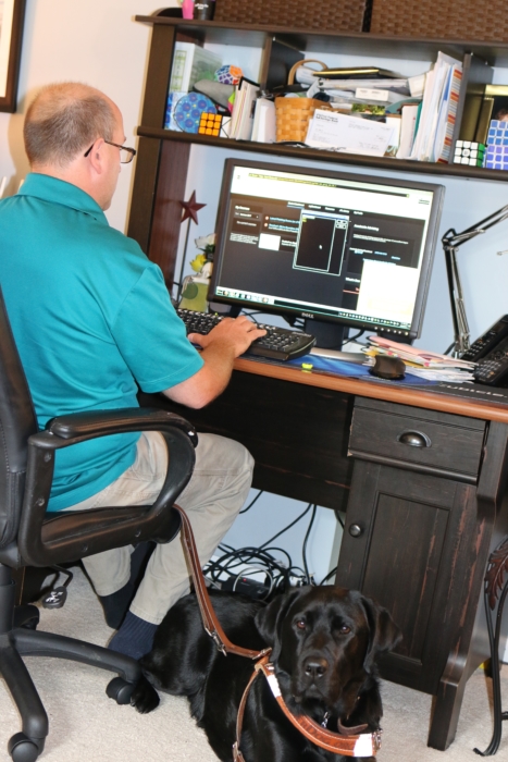 Dave Brodzinski with his service dog, Flynn.