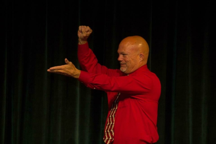 Greg Gantt using ASL at a conference