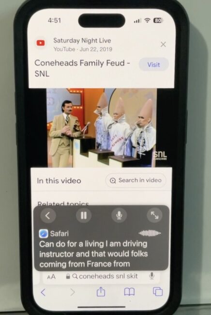 Screenshot of iPhone with Live Captions on captioning a video from Saturday Night Live