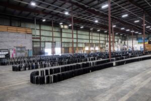 laptops sat up in domino style in the warehouse