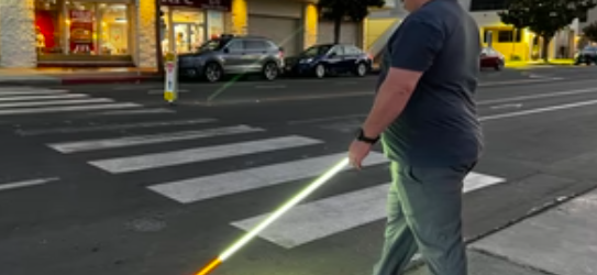see me cane user crossing the street