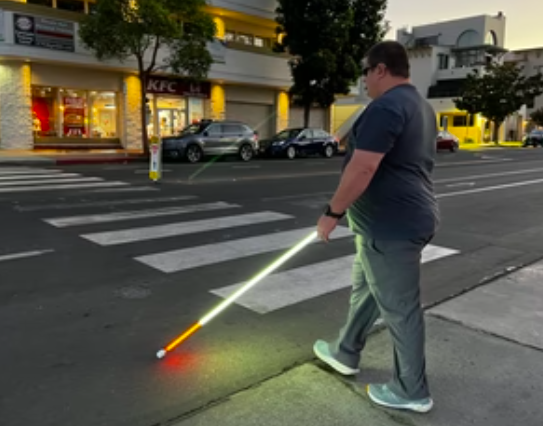 see me cane user crossing the street