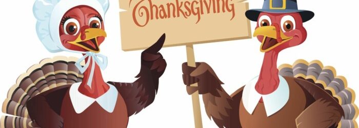Two cartoon turkeys holding a sign saying Happy Thanksgiving