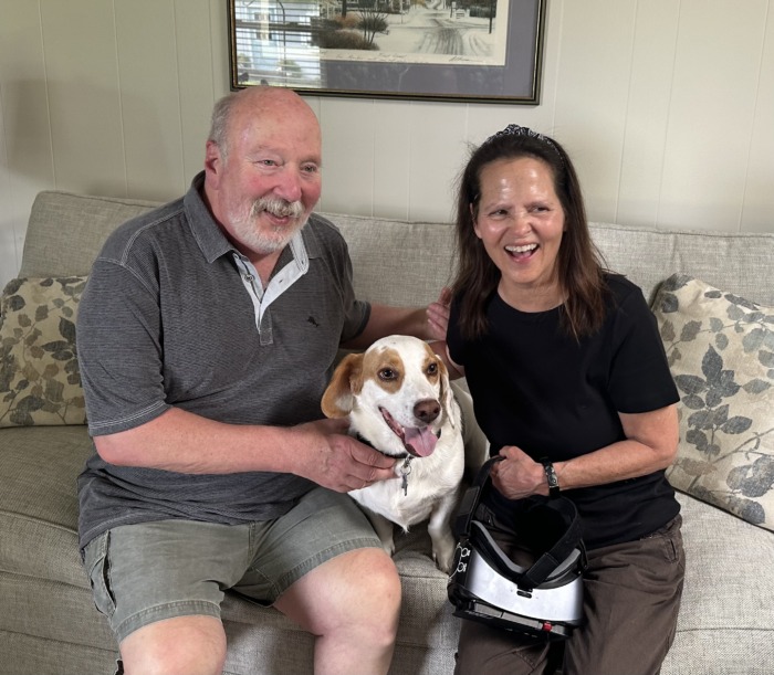 Bob, Nancy, and Scout Butler sitting on couch